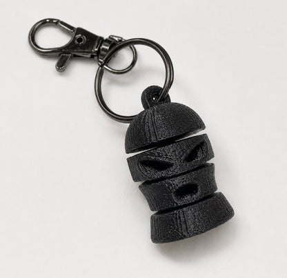 Articulated ski mask keychain showing movable connected sections