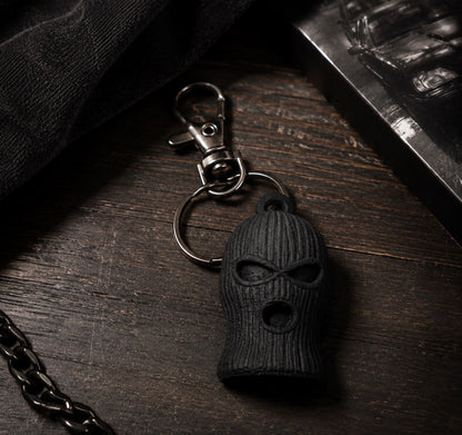 Black SOG ski mask keychain with textured knit detail, split ring and swivel clasp
