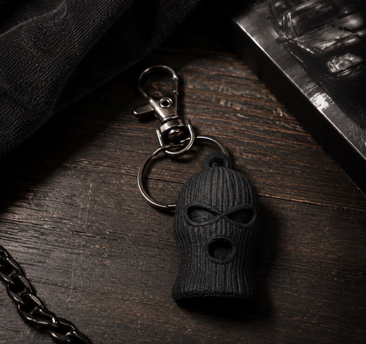 Black SOG ski mask keychain with textured knit detail, split ring and swivel clasp
